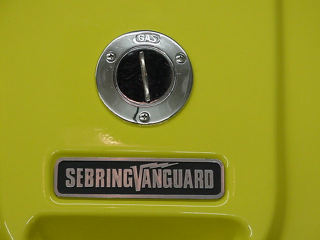 Close up of the boat 'gas' cap (charger plug under the cap) & Sebring Vanguard name plate